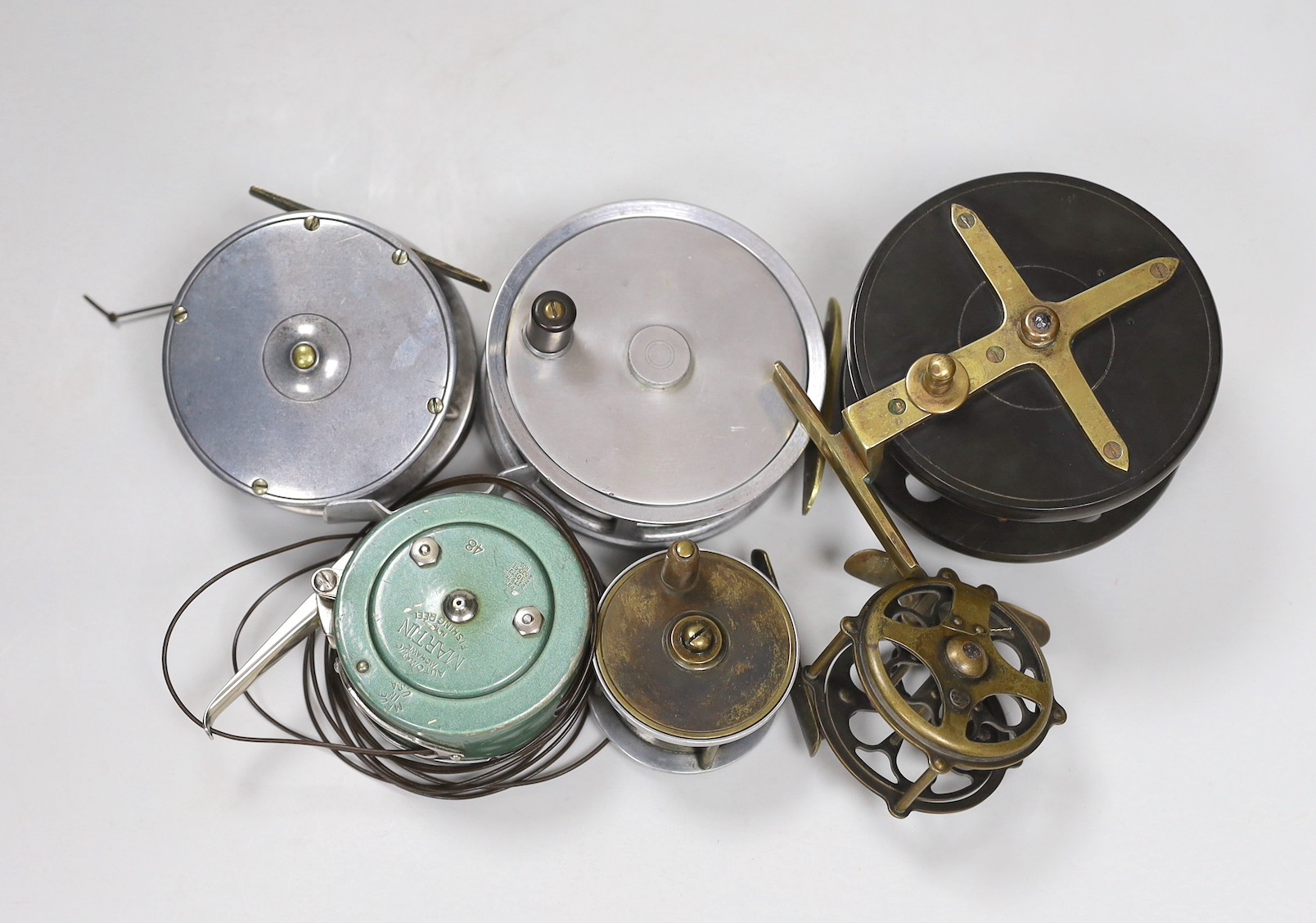 Six fishing reels including a ‘The Tweed 3 7/8 Fly Reel’ and a ‘Martin automatic Mohawk fishing reel’